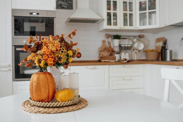 Cozy autumn scene with hot drinks and home comfort.