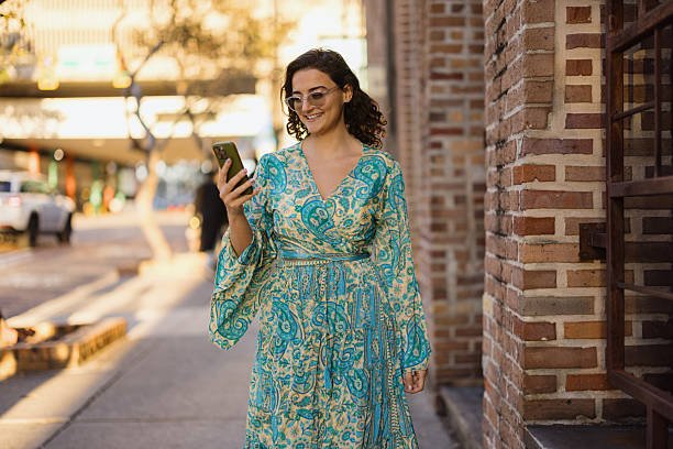 Woman walks, showcasing budget-friendly fashion.