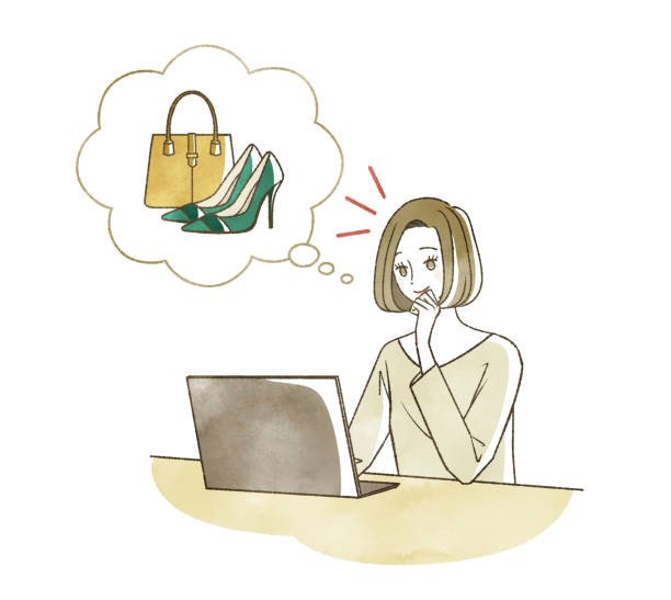 A woman browsing shoes and handbags on her computer screen.