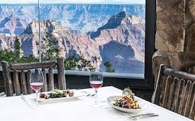 relaxing with a drink at Grand Canyon Lodge, overlooking scenic hills and natural beauty.