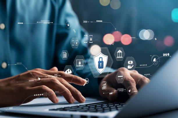 An image illustrating online security for Personal Finance Apps, showing hands typing on a laptop with overlayed icons of data protection, banking, and e-commerce