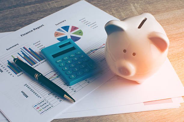 A document titled 'Personal Finance' on a clipboard with a pen, illustrating the first step in managing your personal finance like a pro.