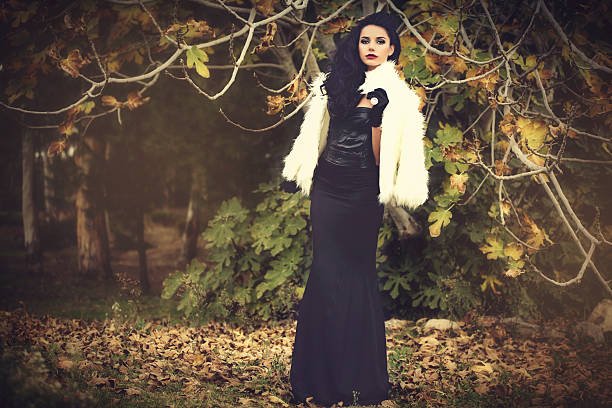 A woman in a chic lace veil and cat ears, embodying the sophisticated style discussed in this article about High-End Halloween Decor Dupes.